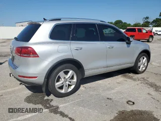 2014 Volkswagen Touareg Lux with VIN WVGEF9BP1ED012267, listed as a Copart auction lot 58924055 with 81,009 mi miles and Salvage title. Bid and sale history available at DreamBid. Image 3.
