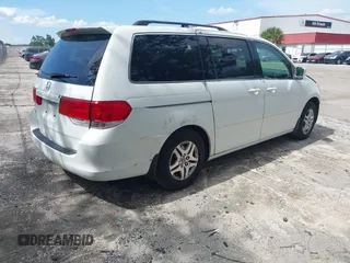 2010 Honda Odyssey EX with VIN 5FNRL3H5XAB015351, listed as a IAAI auction lot 42702296 with 202,919 mi miles and . Bid and sale history available at DreamBid. Image 4.