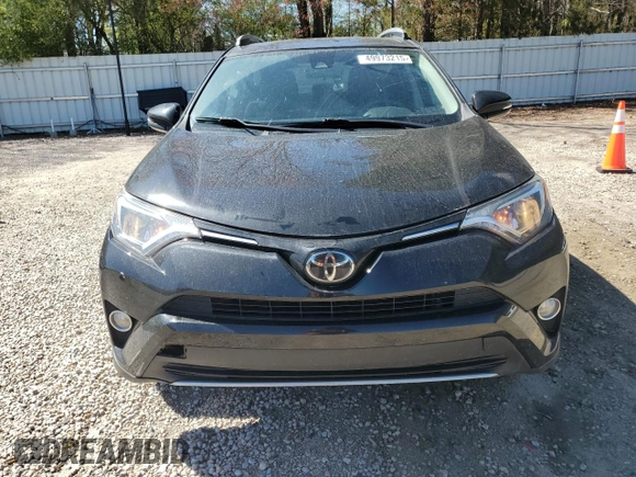 2018 Toyota RAV4 XLE with VIN 2T3WFREV7JW412348, listed as a Copart auction lot 49973215 with 127,661 mi miles and Salvage Title. Bid and sale history available at DreamBid. Image 5.