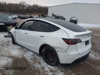 2021 Tesla Model Y Performance with VIN 5YJYGDEF6MF261711, listed as a IAAI auction lot 41176208 with 25,687 mi miles and . Bid and sale history available at DreamBid. Image 3.