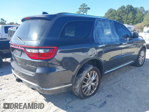 2014 Dodge Durango Citadel with VIN 1C4SDJETXEC390326, listed as a IAAI auction lot 40620779 with 119,537 mi miles and . Bid and sale history available at DreamBid. Image 4.