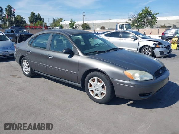 2005 Ford Taurus SE with VIN 1FAFP53U95A289971, listed as a IAAI auction lot 42143134 with 167,702 mi miles. Bid and sale history available at carsss.com. Image 1.