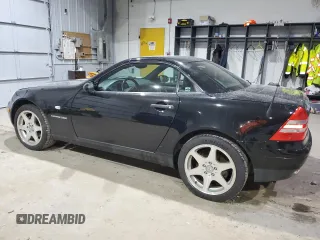 2000 Mercedes-Benz SLK-Class Kompressor with VIN WDBKK47F4YF165805, listed as a Copart auction lot 86942634 with 86,624 mi miles and Salvage Title. Bid and sale history available at carsss.com. Image 2.