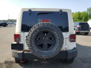 2013 Jeep Wrangler Unlimited Sport z VIN 1C4HJWDG9DL581643, wystawiony jako Copart lot #60775805 z przebiegiem 148 959 mil mil oraz Czysty tytuł • Clean title. Historia ofert i sprzedaży dostępna na DreamBid. Obrazek 6.