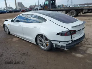 2012 Tesla Model S Performance with VIN 5YJSA1DP4CFP02346, listed as a IAAI auction lot 41642201 with Not Provided miles. Bid and sale history available at carsss.com. Image 3.