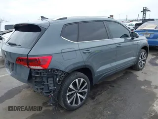 2022 Volkswagen Taos SE z VIN 3VVRX7B21NM007085, wystawiony jako IAAI lot #42018520 z przebiegiem 27 904 mil mil oraz . Historia ofert i sprzedaży dostępna na DreamBid. Obrazek 4.