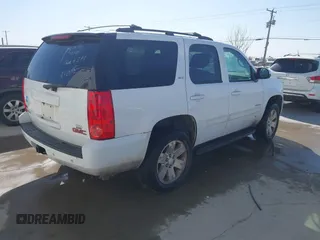 2011 GMC Yukon SLT with VIN 1GKS2CE03BR397395, listed as a IAAI auction lot 41813501 with 220,443 mi miles. Bid and sale history available at carsss.com. Image 4.