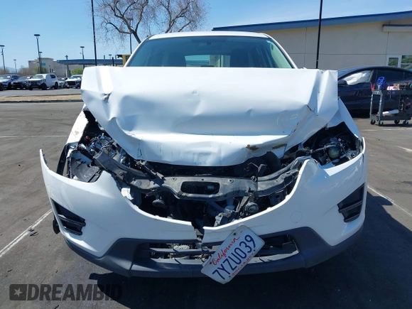 2016 Mazda CX-5 Sport with VIN JM3KE2BY9G0825285, listed as a IAAI auction lot 41841833 with 96,915 mi miles. Bid and sale history available at carsss.com. Image 6.