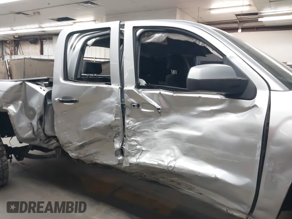 2018 Chevrolet Silverado 1500 LT with VIN 1GCVKREC1JZ151188, listed as a IAAI auction lot 42153618 with 82,391 mi miles and . Bid and sale history available at DreamBid. Image 6.