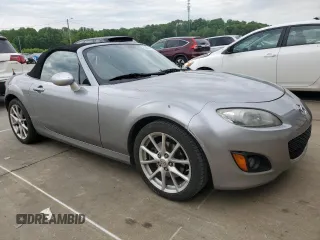 2009 Mazda MX-5 Miata Grand Touring z VIN JM1NC25F090202047, wystawiony jako Copart lot #55810505 z przebiegiem 91 618 mil mil oraz Szkody całkowita. Historia ofert i sprzedaży dostępna na DreamBid. Obrazek 4.