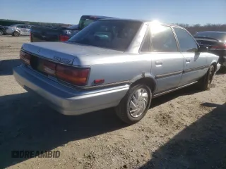 1991 Toyota Camry DLX z VIN 4T1SV21E2MU451022, wystawiony jako Copart lot #45333385 z przebiegiem 229 058 mil mil oraz Szkoda całkowita • Salvage title. Historia ofert i sprzedaży dostępna na DreamBid. Obrazek 3.