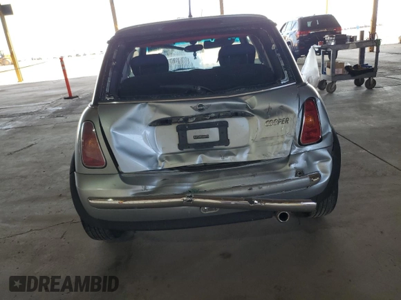 2004 MINI Hardtop with VIN WMWRC33404TJ58046, listed as a Copart auction lot 46358625 with 140,934 mi miles and Salvage Title. Bid and sale history available at DreamBid. Image 6.