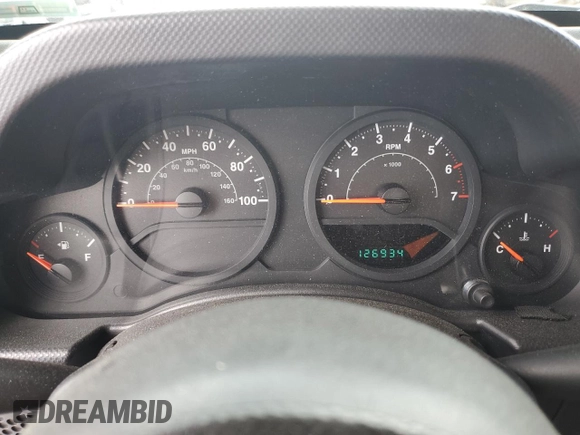 2009 Jeep Wrangler X z VIN 1J4FA24169L706787, wystawiony jako Copart lot #51540265 z przebiegiem 126 934 mil mil oraz Szkoda całkowita • Salvage title. Historia ofert i sprzedaży dostępna na DreamBid. Obrazek 9.
