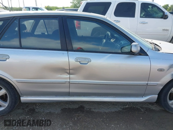 2003 Mazda Protege with VIN JM1BJ245031218333, listed as a IAAI auction lot 42070471 with 181,748 mi miles and . Bid and sale history available at DreamBid. Image 13.