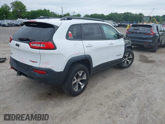 2014 Jeep Cherokee Trailhawk z VIN 1C4PJMBS4EW210719, wystawiony jako IAAI lot #42461733 z przebiegiem 134 096 mil mil oraz . Historia ofert i sprzedaży dostępna na DreamBid. Obrazek 4.