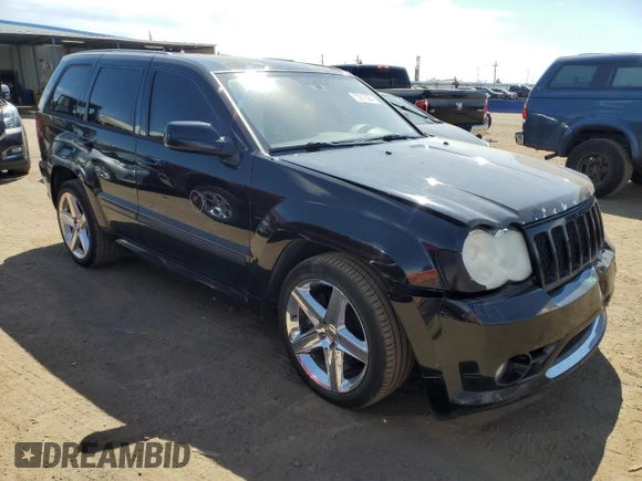 2008 Jeep Grand Cherokee SRT-8 with VIN 1J8HR78308C174606, listed as a Copart auction lot 70313584 with 169,765 mi miles and Salvage Title. Bid and sale history available at carsss.com. Image 4.