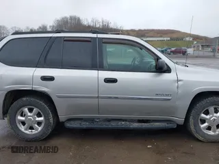 2006 GMC Envoy SLE z VIN 1GKDT13S562187698, wystawiony jako IAAI lot #41808778 z przebiegiem 167 023 mil mil oraz . Historia ofert i sprzedaży dostępna na DreamBid. Obrazek 13.