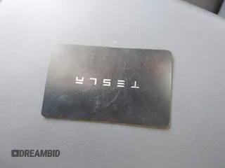 2023 Tesla Model Y Long Range z VIN 7SAYGDEE0PA128888, wystawiony jako IAAI lot #41410085 z przebiegiem 12 578 mil mil oraz . Historia ofert i sprzedaży dostępna na DreamBid. Obrazek 11.