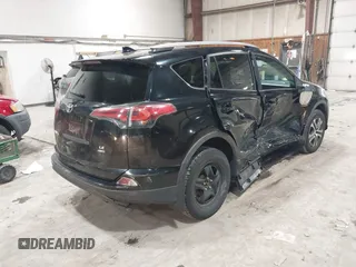 2017 Toyota RAV4 LE with VIN 2T3BFREV8HW571887, listed as a IAAI auction lot 41612815 with 100,742 mi miles and . Bid and sale history available at DreamBid. Image 4.