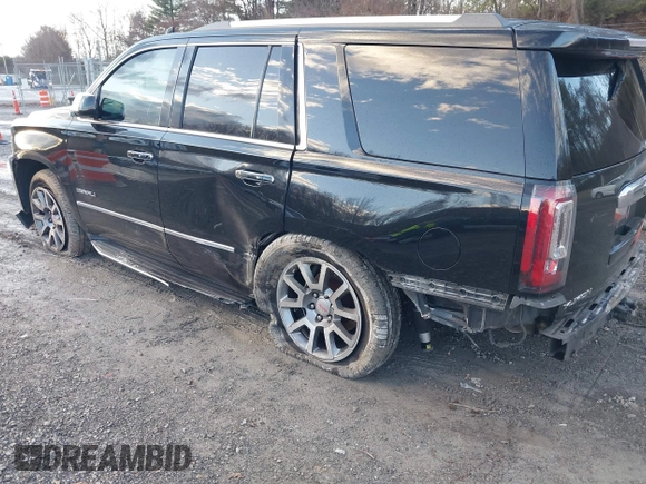 2016 GMC Yukon Denali with VIN 1GKS2CKJ2GR412201, listed as a IAAI auction lot 41185716 with 124,421 mi miles. Bid and sale history available at carsss.com. Image 3.