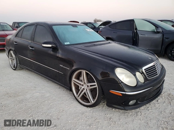 2005 Mercedes-Benz E-Class 5.5L AMG with VIN WDBUF76J05A675937, listed as a Copart auction lot 77349524 with 0 mi miles and Salvage Title. Bid and sale history available at carsss.com. Image 4.