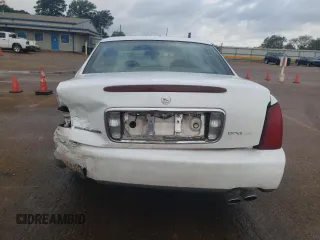2002 Cadillac DeVille z VIN 1G6KD54Y42U247207, wystawiony jako Copart lot #77691724 z przebiegiem 71 514 mil mil oraz Szkody całkowita. Historia ofert i sprzedaży dostępna na DreamBid. Obrazek 6.