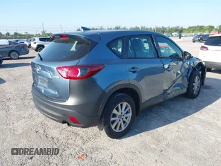 2016 Mazda CX-5 Sport with VIN JM3KE2BY8G0864983, listed as a IAAI auction lot 42072385 with 141,104 mi miles. Bid and sale history available at carsss.com. Image 4.