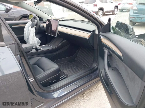 2023 Tesla Model 3 with VIN 5YJ3E1EA3PF699724, listed as a IAAI auction lot 40654814 with 1 mi miles. Bid and sale history available at carsss.com. Image 5.
