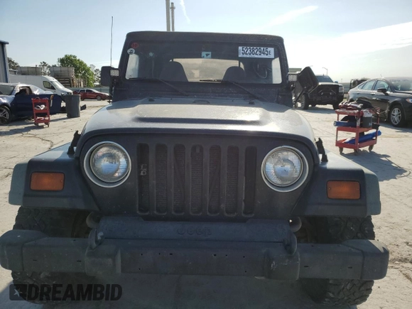 1998 Jeep Wrangler Sport with VIN 1J4FY19S1WP757593, listed as a Copart auction lot 52382945 with 230,086 mi miles and Salvage Title. Bid and sale history available at carsss.com. Image 5.