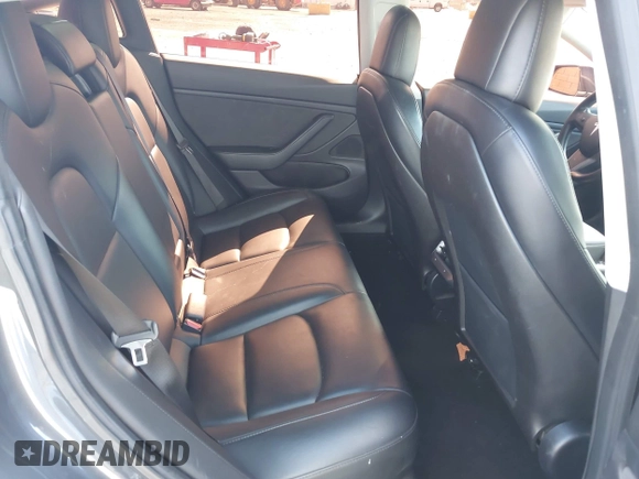 2019 Tesla Model 3 Mid Range with VIN 5YJ3E1EA6KF307456, listed as a IAAI auction lot 41944454 with 99,059 mi miles and . Bid and sale history available at DreamBid. Image 8.