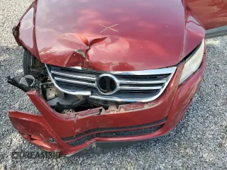 2011 Volkswagen Tiguan S z VIN WVGAV7AX3BW001598, wystawiony jako Copart lot #57518545 z przebiegiem 135 668 mil mil oraz Szkoda całkowita • Salvage title. Historia ofert i sprzedaży dostępna na DreamBid. Obrazek 12.