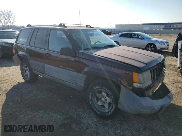 1997 Jeep Grand Cherokee Laredo with VIN 1J4GZ58S9VC687969, listed as a Copart auction lot 79930814 with 0 mi miles and Salvage Title. Bid and sale history available at carsss.com. Image 4.