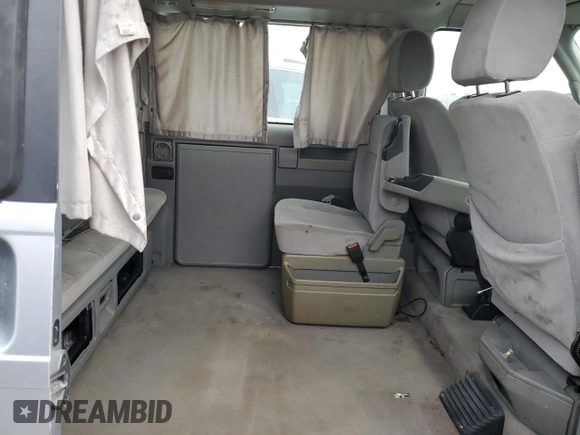 2003 Volkswagen EuroVan MV с VIN WV2NB47083H002700, выставлен на аукционе Copart как лот 76117874 с пробегом 186 942 миль миль и На запчасти • Non repairable. История ставок и продаж доступна на DreamBid. Изображение 11.