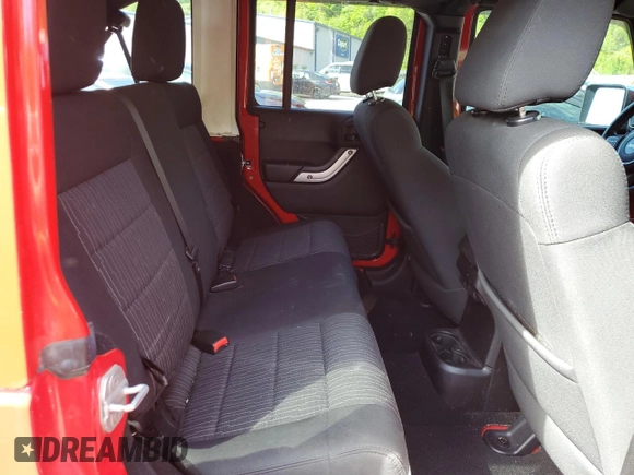 2012 Jeep Wrangler Unlimited Sahara with VIN 1C4BJWEG0CL128417, listed as a Copart auction lot 56243815 with 95,635 mi miles and Salvage title. Bid and sale history available at DreamBid. Image 11.