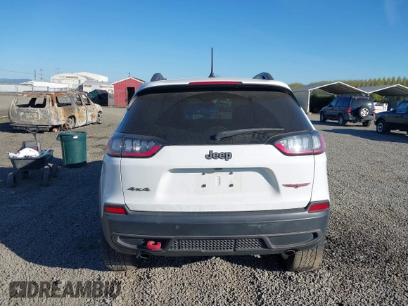 2021 Jeep Cherokee Trailhawk with VIN 1C4PJMBX9MD105888, listed as a IAAI auction lot 42065175 with 55,469 mi miles and . Bid and sale history available at DreamBid. Image 17.
