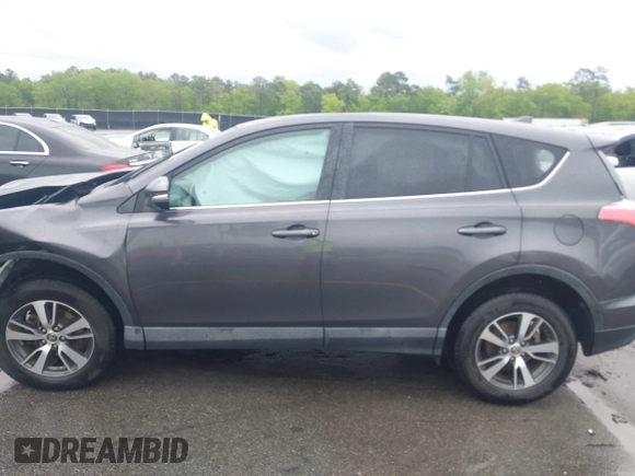 2018 Toyota RAV4 XLE with VIN 2T3RFREV5JW701564, listed as a IAAI auction lot 41976067 with 128,404 mi miles. Bid and sale history available at carsss.com. Image 14.