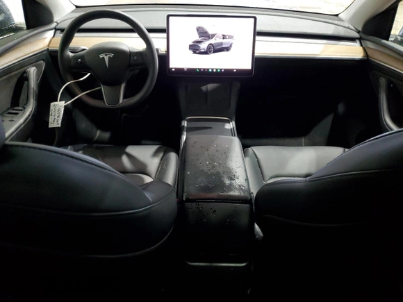 2023 Tesla Model Y Long Range z VIN 7SAYGDEE8PF814874, wystawiony jako Copart lot #56546365 z przebiegiem 20 919 mil mil oraz Szkoda całkowita • Salvage title. Historia ofert i sprzedaży dostępna na DreamBid. Obrazek 8.