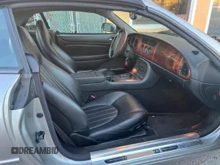 1999 Jaguar XK z VIN SAJGX204XXC041660, wystawiony jako Copart lot #88755785 z przebiegiem 70 091 mil mil oraz Tytuł czysty. Historia ofert i sprzedaży dostępna na DreamBid. Obrazek 5.