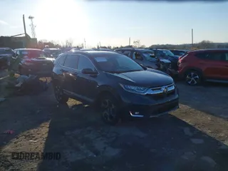 2017 Honda CR-V Touring with VIN 2HKRW2H90HH647274, listed as a IAAI auction lot 41572666 with 95,264 mi miles. Bid and sale history available at carsss.com. Image 1.