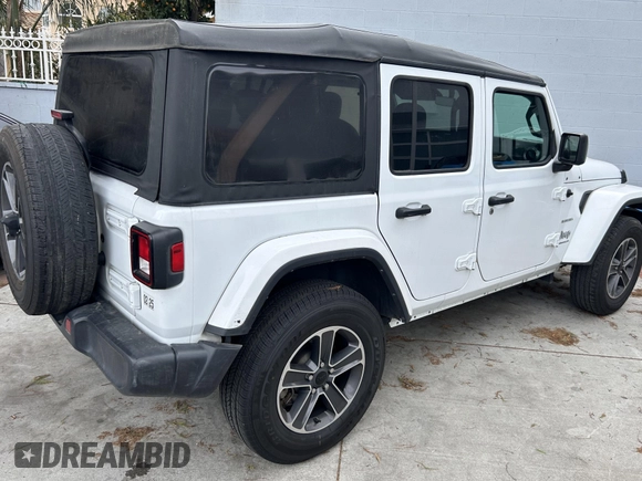 2023 Jeep Wrangler Sahara with VIN 1C4HJXENXPW586579, listed as a IAAI auction lot 41795621 with 34,433 mi miles. Bid and sale history available at carsss.com. Image 4.