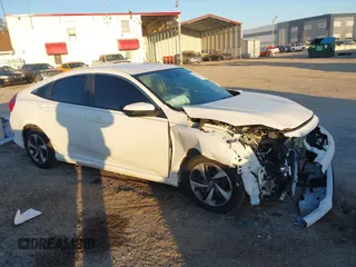 2019 Honda Civic LX with VIN 19XFC2F61KE014007, listed as a IAAI auction lot 41795070 with 64,259 mi miles and . Bid and sale history available at DreamBid. Image 13.