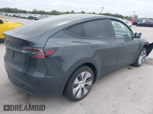 2024 Tesla Model Y with VIN 7SAYGDED3RF002246, listed as a IAAI auction lot 41566184 with 10,316 mi miles and . Bid and sale history available at DreamBid. Image 4.