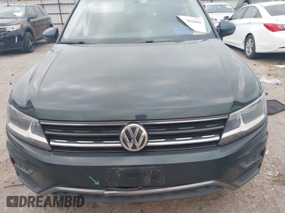 2019 Volkswagen Tiguan S with VIN 3VV1B7AXXKM002312, listed as a IAAI auction lot 42282809 with 80,781 mi miles and . Bid and sale history available at DreamBid. Image 12.