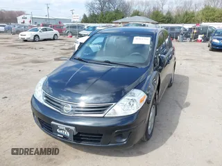 2012 Nissan Versa S with VIN 3N1BC1CP9CK290446, listed as a IAAI auction lot 41861756 with 124,883 mi miles. Bid and sale history available at carsss.com. Image 2.