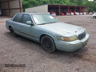 1999 Mercury Grand Marquis GS z VIN 2MEFM74W8XX686921, wystawiony jako IAAI lot #42374777 z przebiegiem 185 166 mil mil oraz . Historia ofert i sprzedaży dostępna na DreamBid. Obrazek 1.
