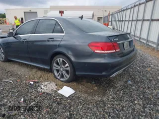 2014 Mercedes-Benz E 350 Sport with VIN WDDHF5KB7EA779952, listed as a IAAI auction lot 42308290 with 100,000 mi miles and . Bid and sale history available at DreamBid. Image 3.