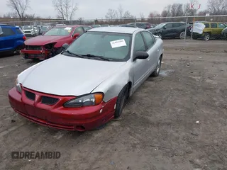 2003 Pontiac Grand Am SE with VIN 1G2NE52F03C323218, listed as a IAAI auction lot 41899309 with 90,195 mi miles. Bid and sale history available at carsss.com. Image 2.