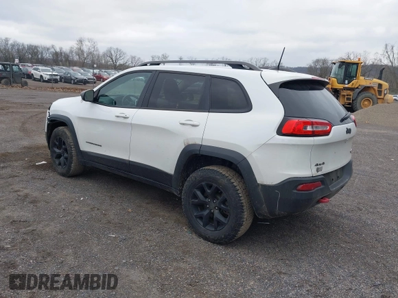 2016 Jeep Cherokee Trailhawk with VIN 1C4PJMBS7GW241076, listed as a IAAI auction lot 42020124 with 151,742 mi miles and . Bid and sale history available at DreamBid. Image 3.