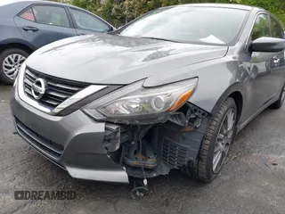 2016 Nissan Altima SR with VIN 1N4AL3AP1GC233201, listed as a IAAI auction lot 41974813 with 117,965 mi miles and . Bid and sale history available at carsss.com. Image 6.