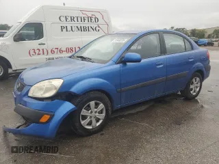 2009 Kia Rio SX with VIN KNADE223896572348, listed as a Copart auction lot 51949235 with 161,546 mi miles and Salvage Title. Bid and sale history available at carsss.com. Image 1.